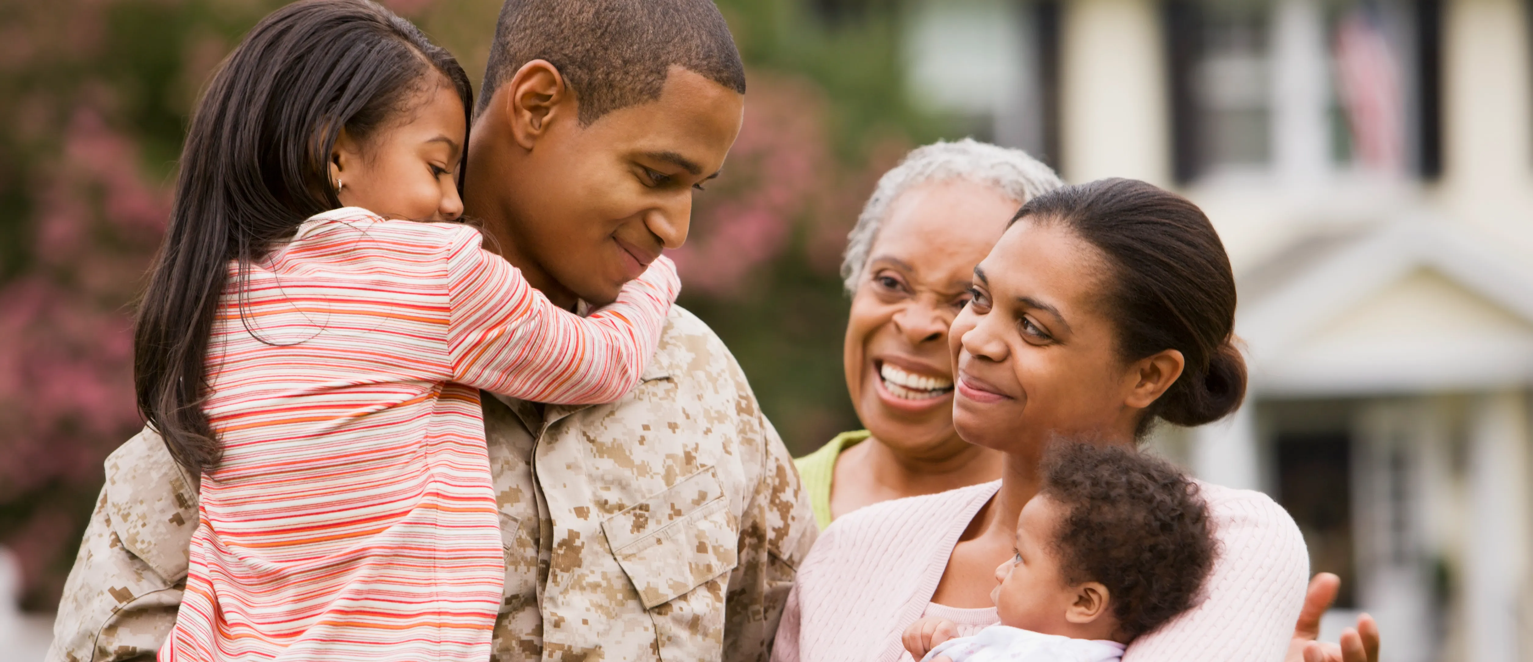 Military family looking lovingly at one another